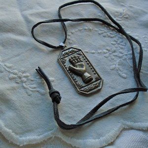 Hallmark vintage arm hand pendant on a leather cord necklace